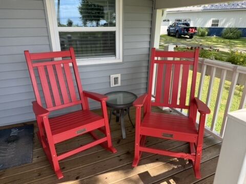 Red rocking chairs on the porch